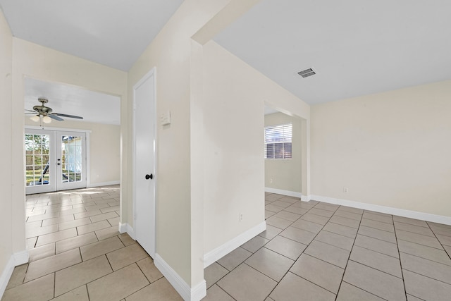 interior space featuring french doors and ceiling fan