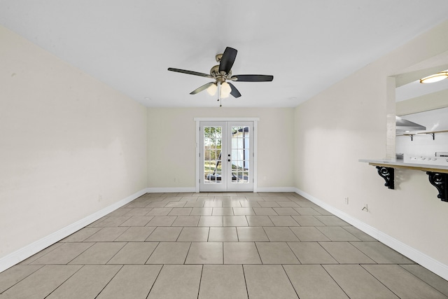 tiled spare room with french doors and ceiling fan