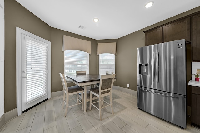 dining space featuring light wood-type flooring