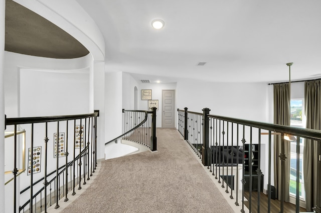 hallway featuring carpet