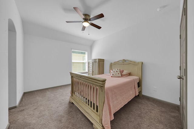 bedroom featuring ceiling fan and dark colored carpet