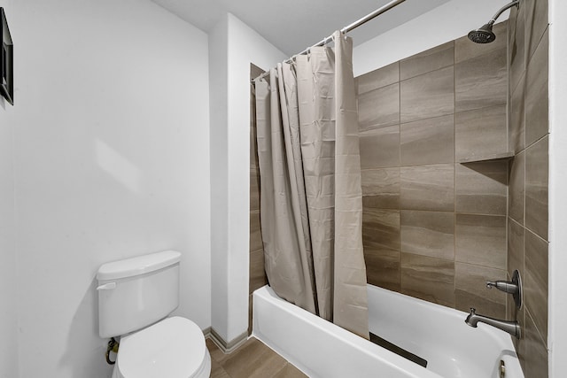 bathroom with wood-type flooring, toilet, and shower / bathtub combination with curtain