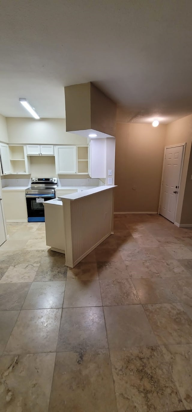 kitchen featuring kitchen peninsula, white cabinets, and stainless steel range with electric cooktop