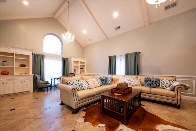 tiled living room featuring high vaulted ceiling and a chandelier