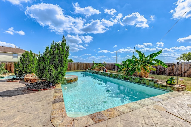 view of swimming pool with a patio area