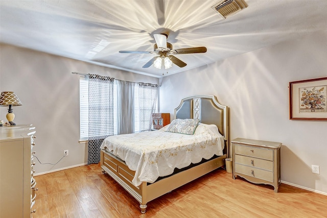 bedroom featuring ceiling fan and light wood-type flooring