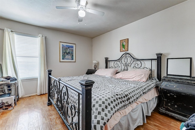 bedroom featuring hardwood / wood-style floors and ceiling fan