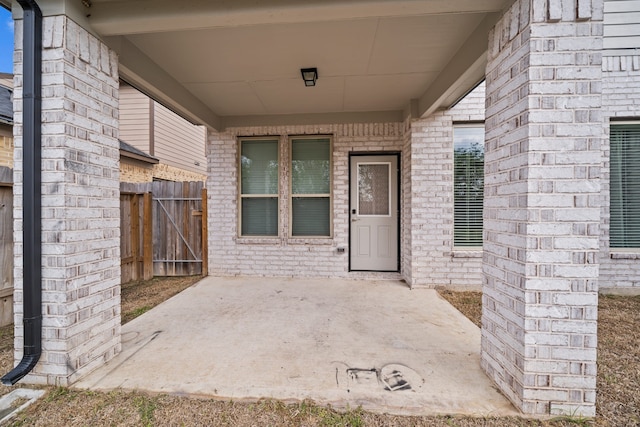 entrance to property featuring a patio area