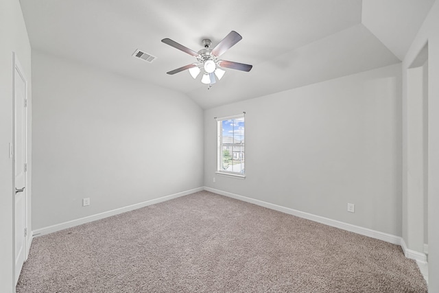 empty room with carpet floors, ceiling fan, and vaulted ceiling