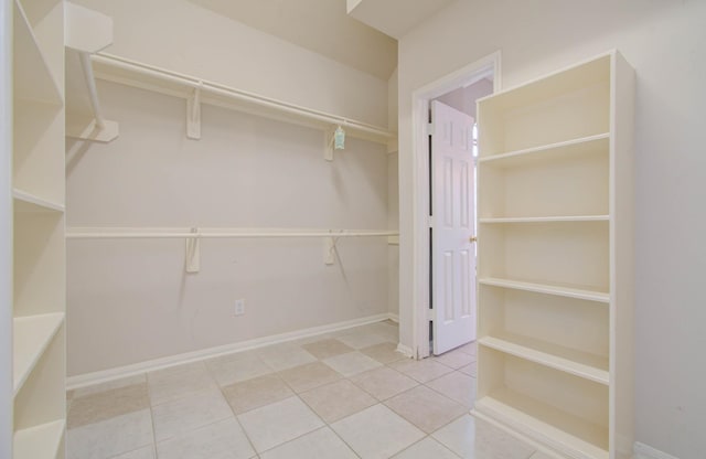 spacious closet with tile patterned floors