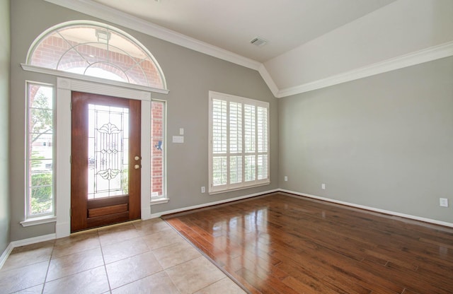 entryway with plenty of natural light, visible vents, and baseboards