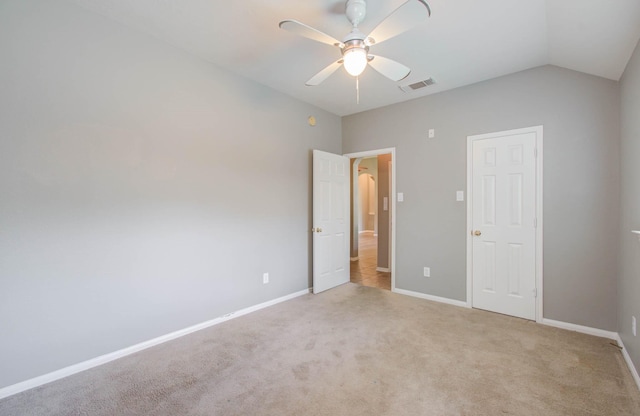 unfurnished bedroom with ceiling fan, baseboards, visible vents, and carpet