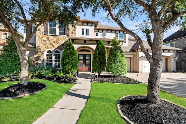 view of front of house with french doors and a front yard