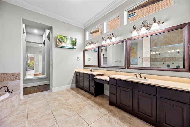 bathroom with vanity, tile patterned floors, ornamental molding, and plenty of natural light