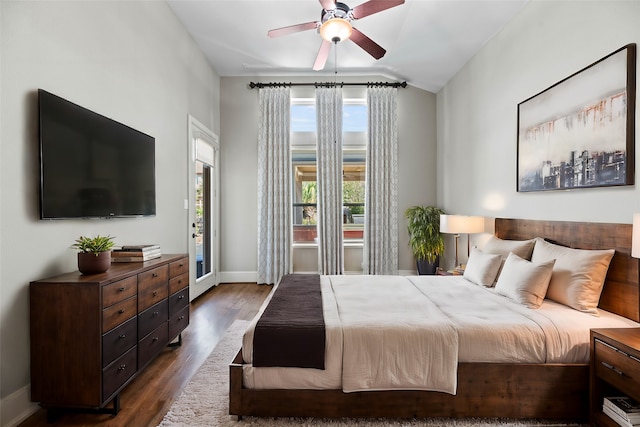 bedroom with lofted ceiling, dark hardwood / wood-style floors, and ceiling fan