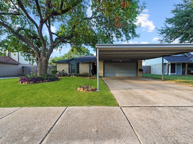 ranch-style house featuring a front yard, a garage, and a carport