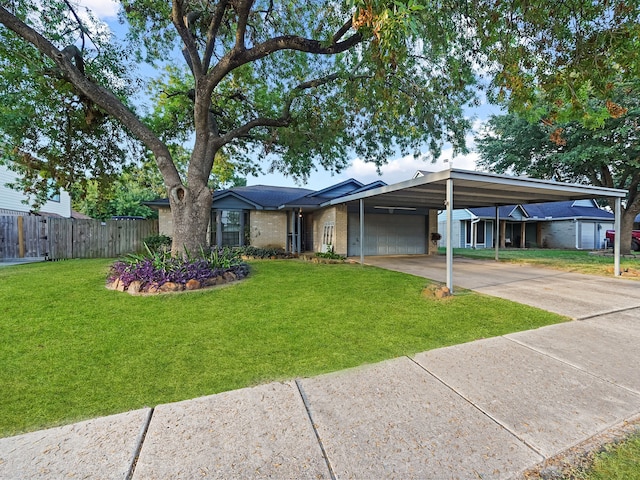 single story home with a carport, a front lawn, and a garage