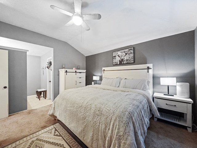 bedroom with ceiling fan, carpet, and vaulted ceiling