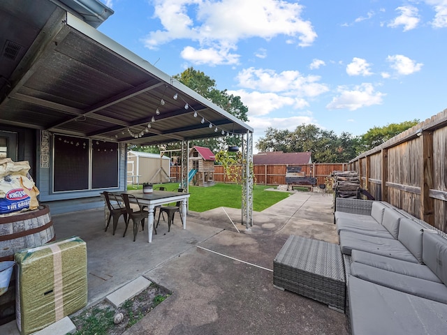 view of patio / terrace featuring a storage shed, a playground, and outdoor lounge area