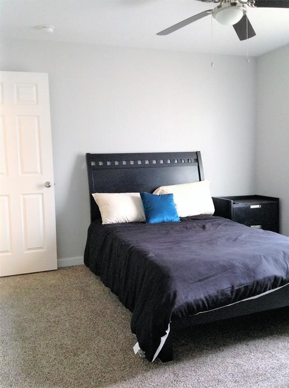 bedroom with carpet and ceiling fan