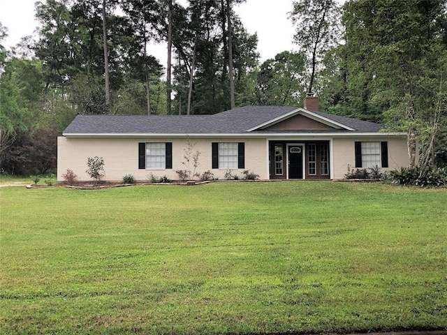 ranch-style house featuring a front lawn