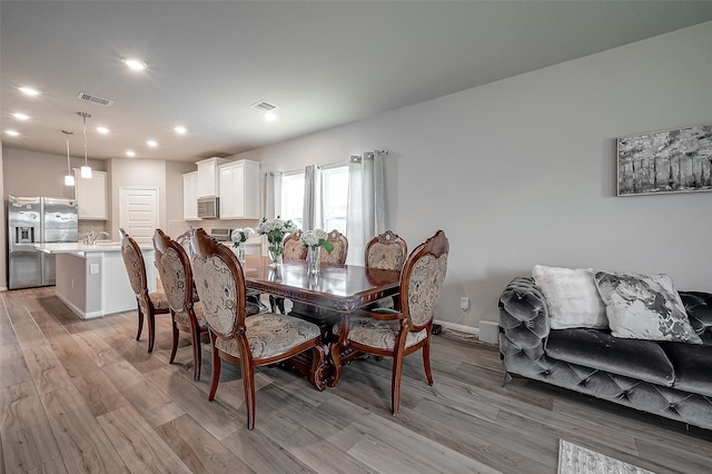 dining area featuring light hardwood / wood-style flooring