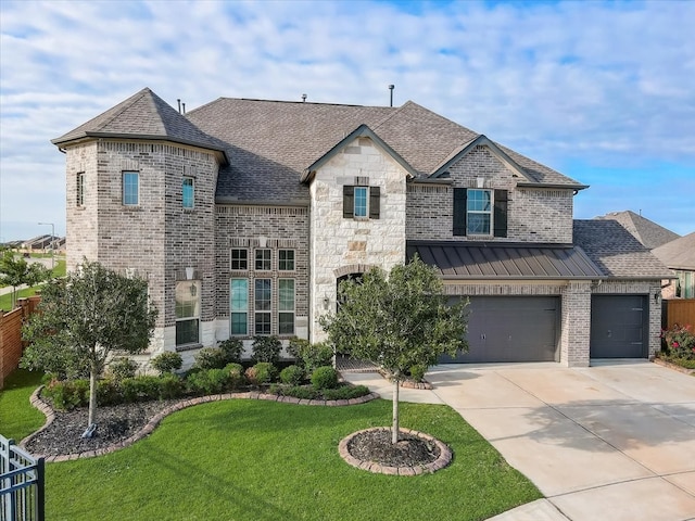 french country style house with a front lawn and a garage