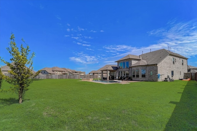 view of yard featuring a patio and a fenced in pool