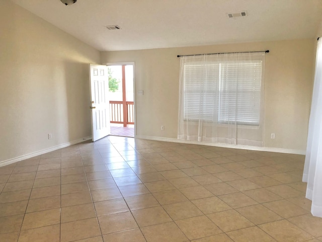 spare room featuring light tile patterned floors