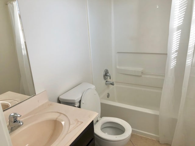 full bathroom featuring vanity, shower / tub combo with curtain, toilet, and tile patterned floors