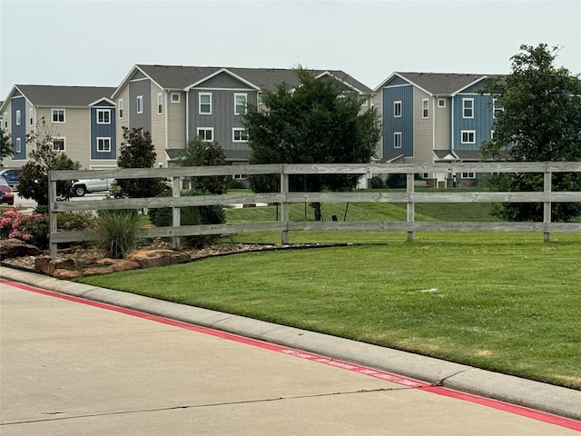 view of home's community featuring a yard