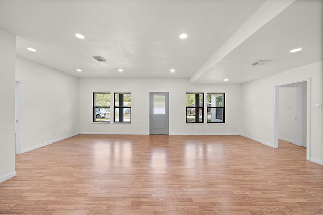 unfurnished living room with light hardwood / wood-style floors