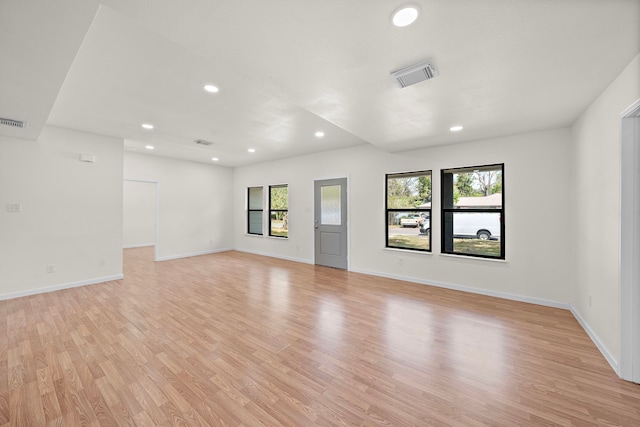 spare room featuring light wood-type flooring