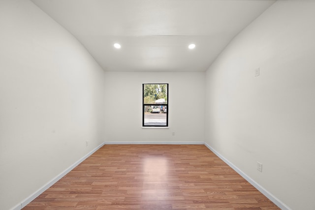 empty room with light hardwood / wood-style floors