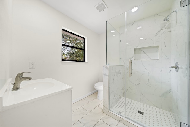 bathroom featuring vanity, toilet, and walk in shower