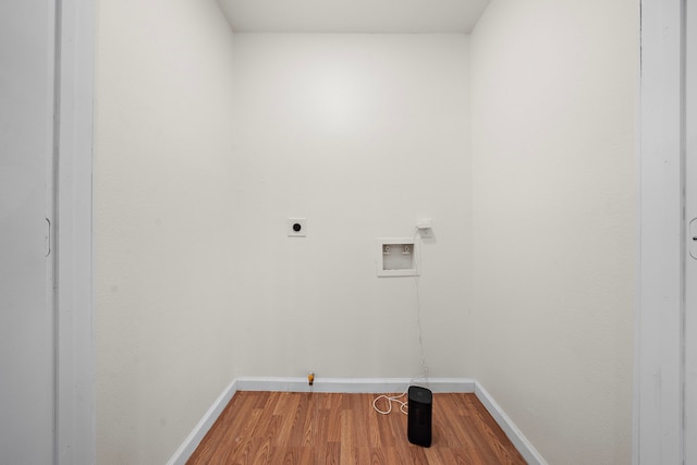 clothes washing area featuring gas dryer hookup, electric dryer hookup, hookup for a washing machine, and wood-type flooring