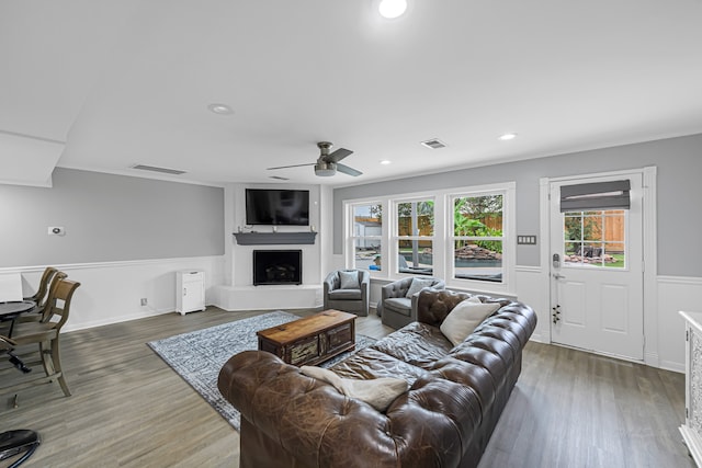 living room with ceiling fan and dark hardwood / wood-style floors