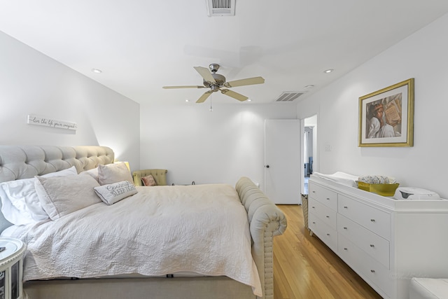 bedroom with light wood-type flooring and ceiling fan