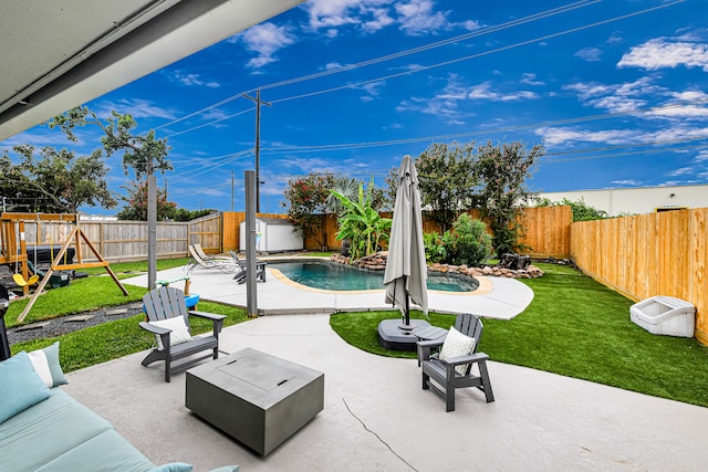 view of patio with a fenced in pool