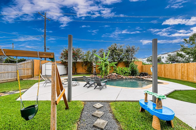 view of pool featuring a yard and a patio area