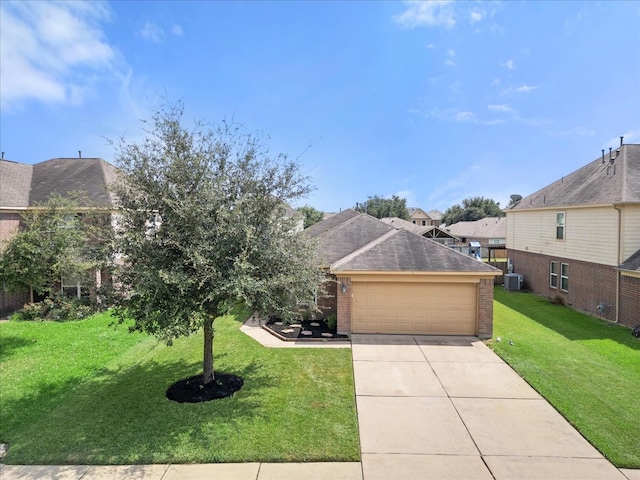 view of front of house with a front yard, a garage, and cooling unit