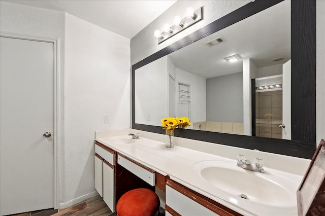 bathroom featuring vanity and hardwood / wood-style floors