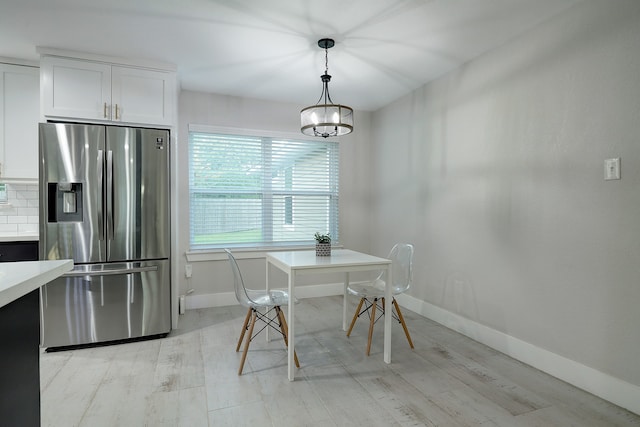 unfurnished dining area with light hardwood / wood-style flooring