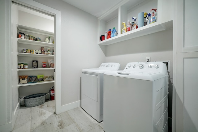 laundry room with separate washer and dryer