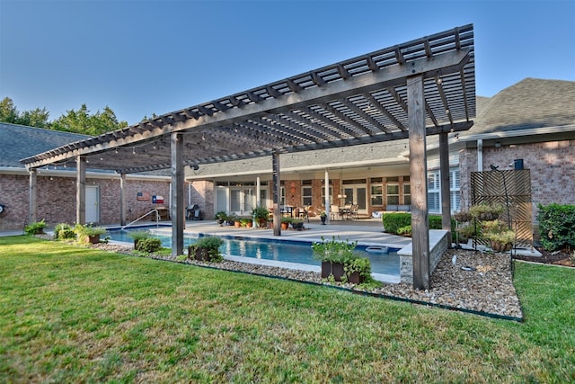 851 Elm Dr, Brenham, TX 77833 - rear view of property featuring a pergola, a lawn, and brick siding