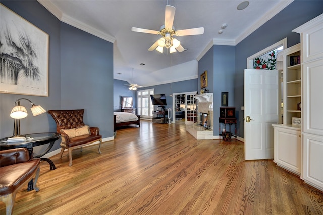 851 Elm Dr, Brenham, TX 77833 - living area featuring ceiling fan, light wood finished floors, ornamental molding, and baseboards