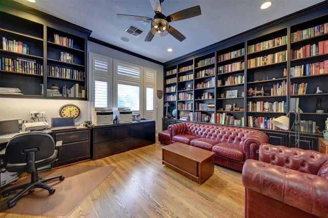 851 Elm Dr, Brenham, TX 77833 - office featuring a ceiling fan, crown molding, light wood-style flooring, wall of books, and recessed lighting