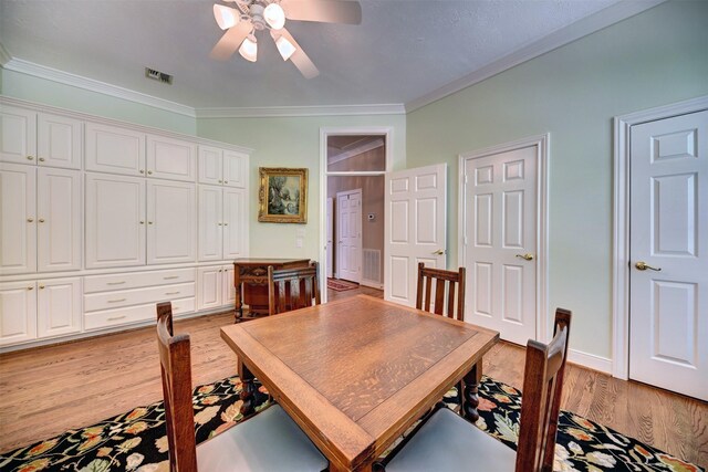 851 Elm Dr, Brenham, TX 77833 - dining room with light wood-style floors, a ceiling fan, ornamental molding, and baseboards