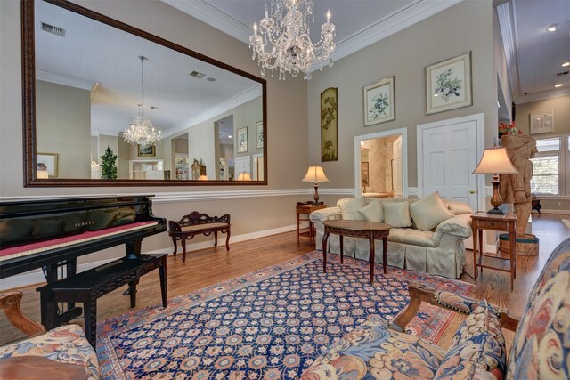 851 Elm Dr, Brenham, TX 77833 - living room with a chandelier, wood finished floors, crown molding, and baseboards