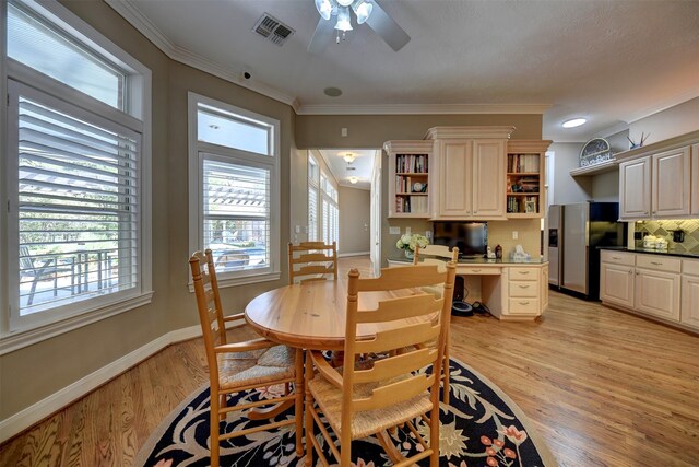 851 Elm Dr, Brenham, TX 77833 - dining space with ceiling fan, light wood-style floors, baseboards, and crown molding